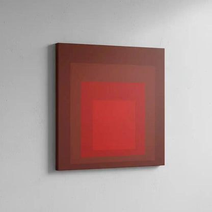 Tableau minimaliste avec carrés rouges imbriqués, rouge intense, ambiance captivante pour salon moderne ou bureau.