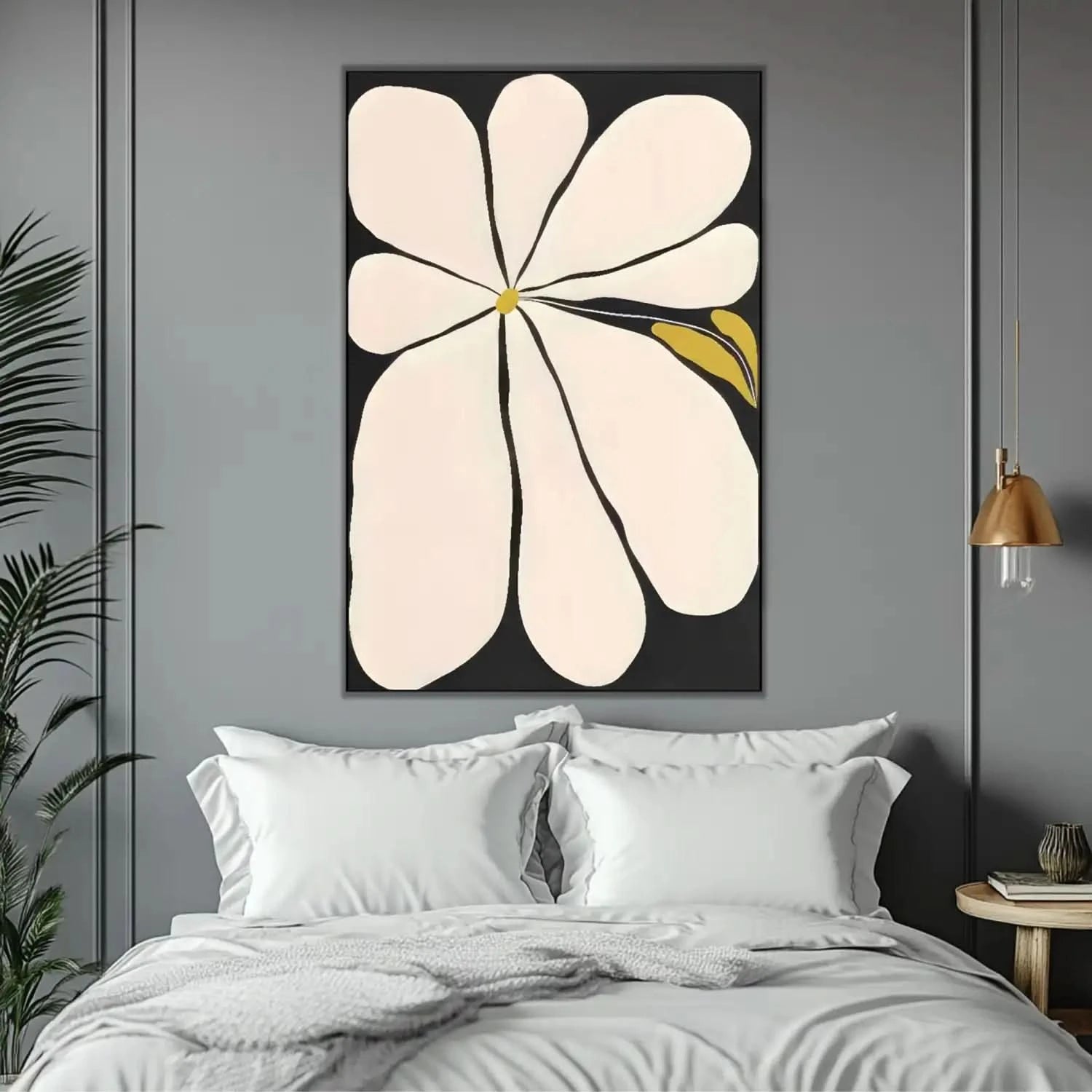 Tableau minimaliste avec fleur blanche sur fond noir, touches de jaune, ambiance sereine pour salon ou chambre moderne.