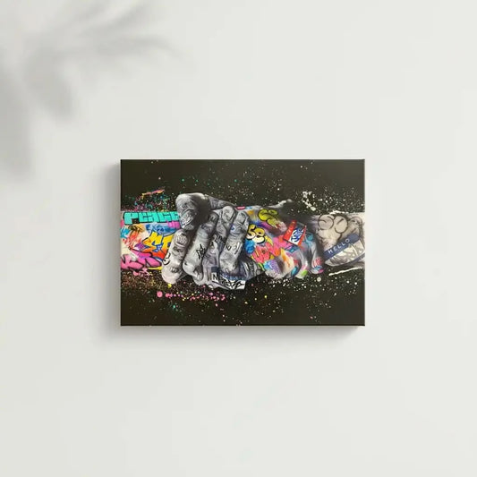 Tableau street art avec poignée de main, graffitis multicolores, ambiance urbaine et dynamique pour salon moderne ou bureau.
