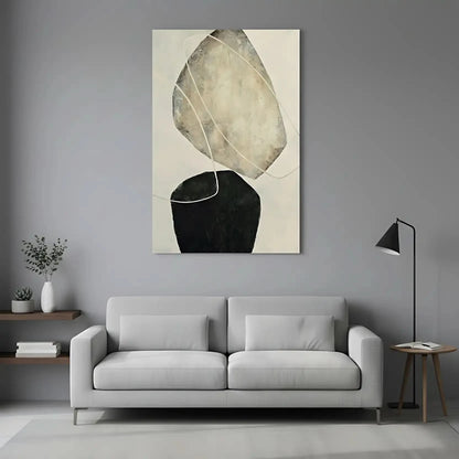 Tableau abstrait avec formes suspendues en tons beige et noir. Style moderne, idéal pour un salon épuré.