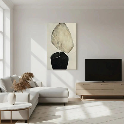 Tableau abstrait avec formes suspendues en tons beige et noir. Style moderne, idéal pour un salon épuré.