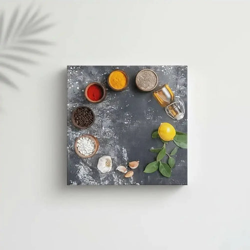 Nature morte minimaliste avec épices rouges et jaunes, grains de café, ail et citron; composition épurée.