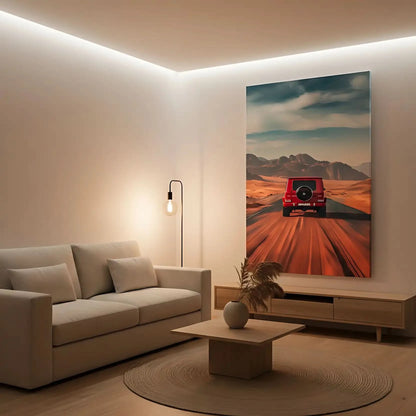 Photographie d'un voiture rouge roulant sur une route désertique, avec un paysage de montagnes lointaines, créant une ambiance d'aventure.