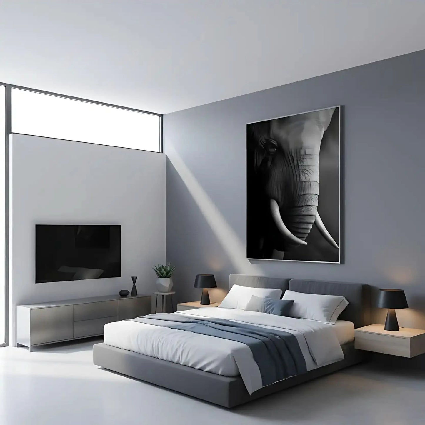 Gros plan en noir et blanc sur le visage d'un éléphant mettant en valeur la texture de sa peau et la courbe de sa défense.